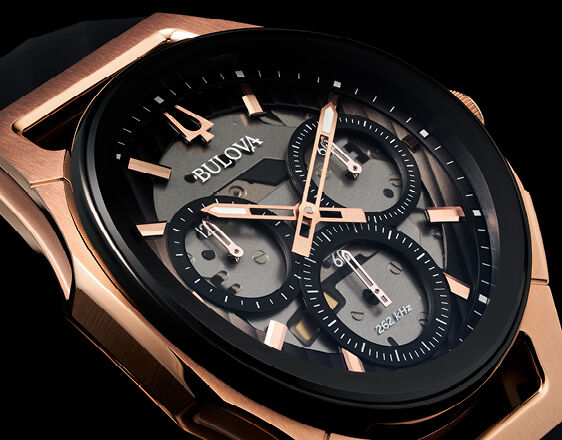 Close-up of Bulova CURV chronograph watch with skeleton dial and rose gold-tone case.